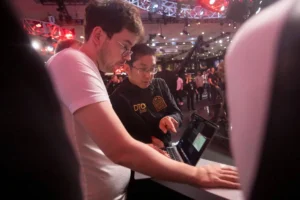 Jonathan Tamayo consulting a laptop during the 2024 World Series of Poker Main Event